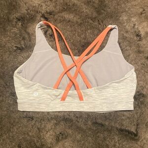 Lululemon size 12 energy bra. Good condition, grey with pink straps.